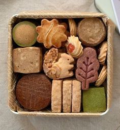 a box filled with different types of cookies