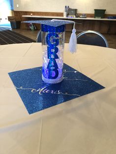 a blue graduation cap on top of a table