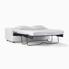 a bed with a pull out mattress on top of it