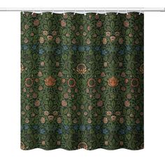 a green shower curtain with an ornate design on the bottom and side, in front of a white background