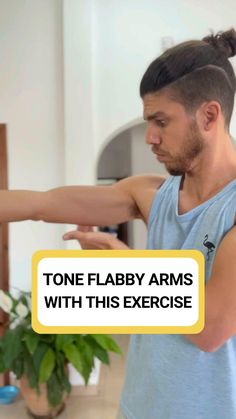 a man in a blue tank top holding his arm out with the words tone flap arms with this exercise