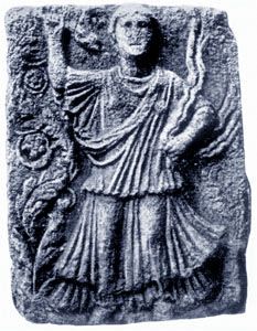 an ancient stone plaque with a man holding a bird in one hand and a flower in the other