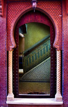 an open doorway with a staircase in the middle