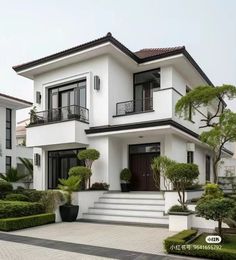 a white two story house with black trim