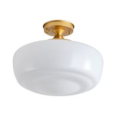 a light fixture with a white glass shade on the top and gold trimmings