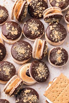 chocolate covered cookies and macaroons with peanut butter on top