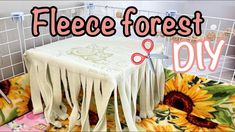 there is a table covered with white cloths and the words fleece forest diy