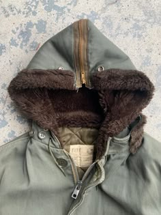 Vintage 50s B-9 Parka Flight Military Split Hood Jacket Perfect condition no flaws at all. Heavyweight quilted lined and warm. So many good details on this thing. 23 inch pit 31 inch length 20 1/4 inch shoulders 17 1/4 inch sleeve from pit Vintage Cotton Parka, Vintage Hooded Outerwear For Outdoor, Vintage Lined Outerwear For Winter, Vintage Lined Winter Outerwear, Vintage Hooded Outerwear With Double-lined Hood, Vintage Outerwear With Padded Collar For Streetwear, Vintage Streetwear Outerwear With Padded Collar, Vintage Parka With Double-lined Hood For Fall, Vintage Parka With Pockets For Cold Weather