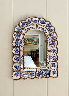 a mirror that is hanging on the wall