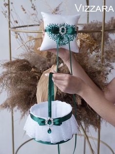 a woman is holding two decorative items in front of her face