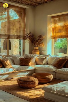 a living room filled with lots of white furniture