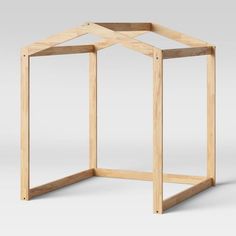 a wooden structure that is shaped like an octagon, with the top section cut out