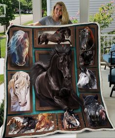 a woman holding up a blanket with horses on it