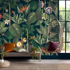 a room with a birdcage and flowers on the wall next to a window