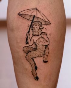 a man with an umbrella tattoo on his leg