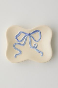 a white plate with a blue bow on it