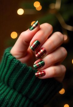 Get cozy with plaid Christmas nails! Choose festive colors like red, green, and gold for the perfect holiday vibe. Use striping tape or a fine nail brush to create the plaid pattern on an accent nail while keeping the others a solid color or glittery. Add a matte top coat for a modern touch or keep it glossy for a traditional look. Plaid nails pair perfectly with winter sweaters and holiday cheer!  #PlaidNails #ChristmasNailArt #FestiveManicure #CozyHolidayLooks #WinterNails  Try this classic design to bring warmth and style to your holiday nails! Green Plaid Nails Christmas, Red Green And Gold Nails Christmas, Christmas Nails Tartan, Plaid And Sweater Nails, Christmas Plaid Nails Design, Red And Green Plaid Nails, Winter Plaid Nails, Christmas Nails Matte, Christmas Nails Plaid