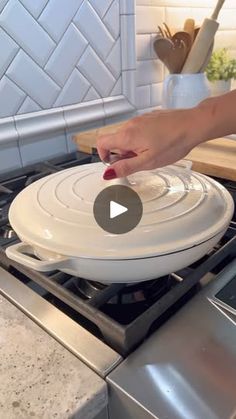 a person using a spatula to stir food on top of an oven burner