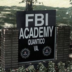 a black and white sign that reads fbi academy quanticco va