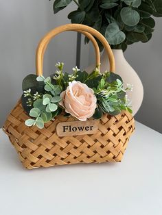 a basket that has flowers in it on a table