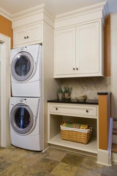 a washer and dryer in a small room