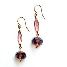 "Simply elegant earrings in dark red onion glass with gold combine vintage open back bezel set navettes above faceted onion shape rondelles. These have a smoky purple color and are quality made, 14K gold filled jewelry. A Mas Collected exclusive with unabashed elegance.  We made these one of a kind. Era: Mid Century (rescued glass findings and beads). Measurements: Overall length, 2.75\", dangles 1.75\". Width is .5\" Markings: 1/20 14K.  Materials: Salvaged machine cut crystals in dark red onio Crystal Dangle Earrings, Gold And Silver Rings, Purple Glass, Gold Filled Jewelry, Elegant Earrings, Jewelry Earrings Dangle, Gold Earrings, Gold Filled, Sterling Silver Rings