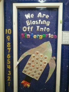 a bulletin board with an image of a rocket ship and the words we are blasting off into space