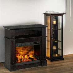 an entertainment center with a fireplace in the middle and a lighted display case next to it