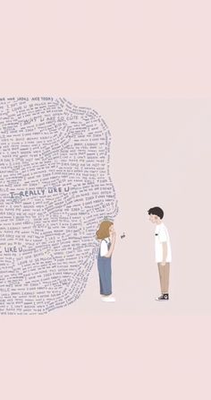 two people standing next to each other with words all over them