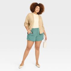 Create an array of cool and confident warm-weather looks with these High-Rise Tailored Shorts from A New Day™. Made from lightweight fabric with a hint of spandex, these high-rise shorts offer all-day cool comfort and easy movement. Designed with a fly hook and zipper, they feature two side pockets to add functional flair to your look, while the solid hue makes for easy pairing with different tops. A New Day™: Style that goes wherever you do. Versatile Spring Loungewear Shorts, Casual Knee-length Shorts For Fall, Solid Color Relaxed Fit Shorts For Fall, Relaxed Fit Bottoms For Warm Weather Day Out, Casual Bottoms For Warm Weather Day Out, Short Length Bottoms For Warm Weather Day Out, Versatile Short Bottoms For Spring, Versatile Short-length Bottoms For Spring, Versatile Short Length Bottoms For Spring