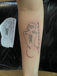 a woman's arm with a tattoo on it