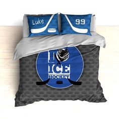 a bed with two pillows on top of it and an image of a hockey goalie