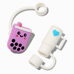 a pink and white phone holder with a blue heart on the side, attached to a wall hook