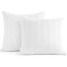 two white pillows sitting next to each other