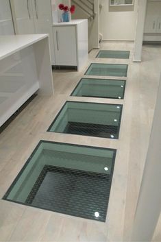 the floor in this bathroom is made out of glass and has been installed to look like an underwater pool