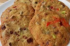 four cookies sitting on top of a white plate