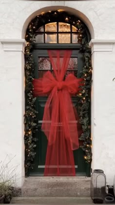 a red bow on the front door of a house