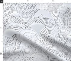 white paper with an intricate design on the side and measurements for each piece in front