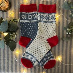 two pairs of socks sitting on top of a table