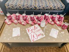 a table topped with lots of pink cups