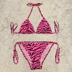 ‘Pink Zebra’ Chuns String Bikini. Mesh Lining In The Top And Front Of The Bottoms. Adjustable Triangle Top. No Size Tag But It’s Completely Adjustable And Looks To Fit A Small/Medium. New And Never Worn. Pink Halter Neck Swimwear For Summer, Pink Stretch Swimwear With Triangle Top, Pink Triangle Top Stretch Swimwear, Pink Stretch Triangle Top Swimwear, Trendy Fitted Pink Swimwear, Trendy Pink Triangle Top Swimwear, Pink Zebra, Triangle Top, Size Tag