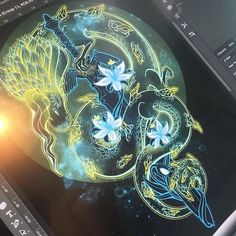 a computer screen with an image of a dragon on it's side and another drawing in the background