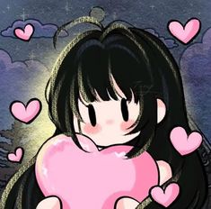 a girl holding a pink heart in her hands with many hearts around her neck and chest