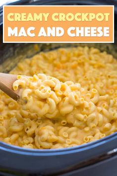 creamy crockpot mac and cheese in a slow cooker with a wooden spoon