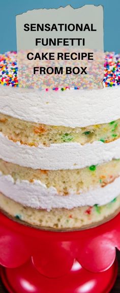 there is a cake with white frosting and sprinkles on the top