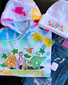 A fun, colorful hoodie perfect for all the tree star lovers out there! 🦕🌈 Model is wearing size medium. This hoodie is unisex and printed direct-to-garment on 80/20 super soft cotton and polyester. For maximum color vibrancy, turn inside out before washing & drying 🫧 Fun Cotton Hoodie With Cartoon Print, Playful Hoodie With Graphic Print For Spring, Playful Spring Hoodie With Graphic Print, Playful Graphic Print Hoodie For Spring, Fun Winter Hoodie, Fun Graphic Print Hoodie For Spring, Playful Cotton Hoodie With Graphic Print, Playful Hooded Hoodie For Streetwear, Multicolor Cartoon Print Hooded Hoodie