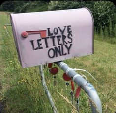 a mailbox that has the words love letters only written in black ink on it