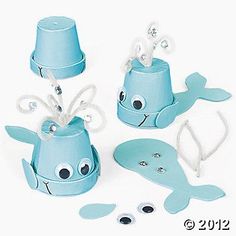 a set of three little blue whale toys