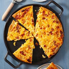 there is a pizza that has been cut into slices on the plate and ready to be eaten