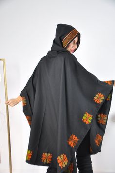 This vintage cape jacket is definitely a vintage fashion statement. It is 100% hand embroidered with geometrical patterns. It can be used over a jeans and shirt or sweater. Great to keep you warm. Please note that the capes we have at the moment (Option #1 and Option #2) are without a hoodie but they are just as beautiful and practical. Material : Wool Length : 49 inches Size : One size fits all. We ship your order with DHL express within one to two business days. Orders to Europe will typically Jeans And Shirt, Wool Cloak, Hooded Shawl, Winter Cloak, Shawl Winter, Hooded Wool Coat, Vintage Cape, Cape Jacket, Hooded Cape